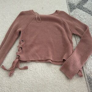 Sweater with bows on side